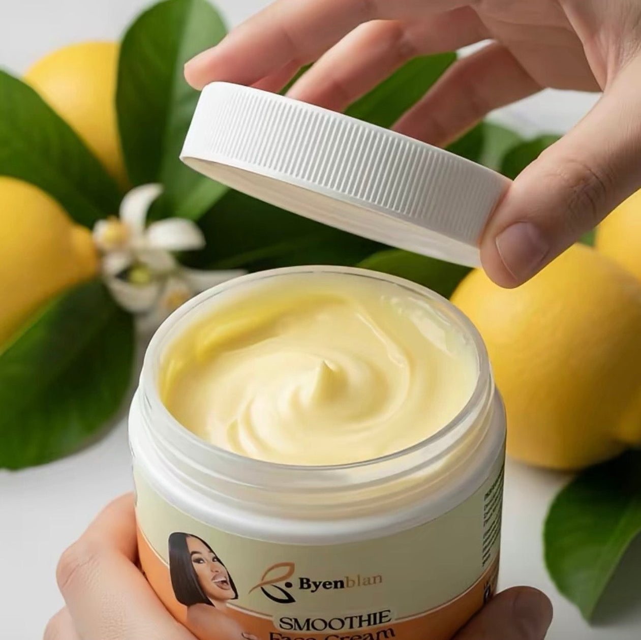 Jar of Byen Man Smoothie Face Cream with lemons and green leaves in the background